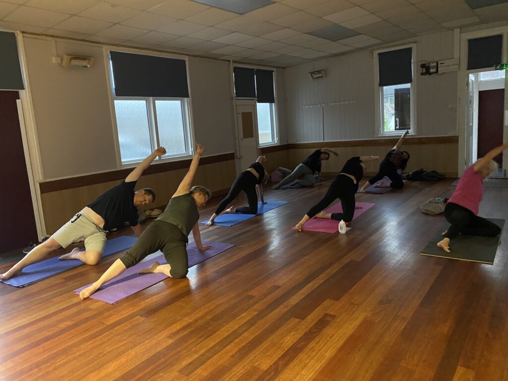 Mazza yoga students in pose inclusive