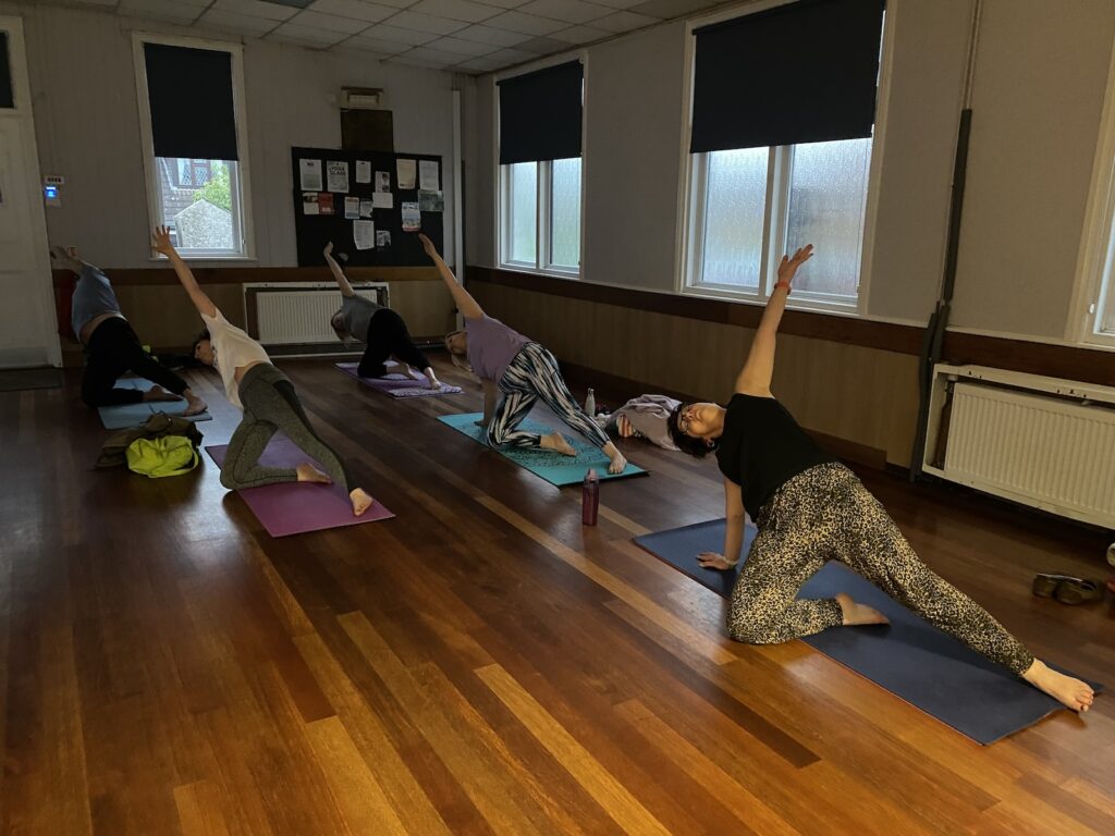 Mazza yoga students in pose